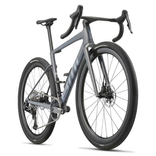 BMC Kaius 01 TWO Copper Grey, front three-quarter view with ICS Carbon Aero one-piece cockpit and 45 mm gravel tyres