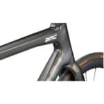 Close-up of the BMC Teammachine SLR 01 FOUR down tube and head tube in Gold Glitter Carbon with the Aerocore Design profile