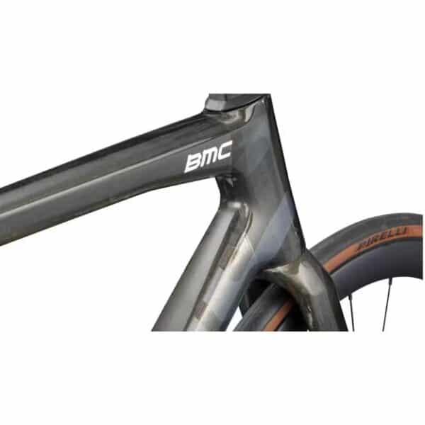 Close-up of the BMC Teammachine SLR 01 FOUR down tube and head tube in Gold Glitter Carbon with the Aerocore Design profile