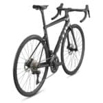 Rear three-quarter view of the black BMC Teammachine SLR TWO road bike