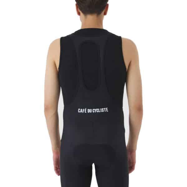 Close-up of the wide embossed elastic bib straps and mesh back panel on the Cafe du Cycliste Cecile bib short