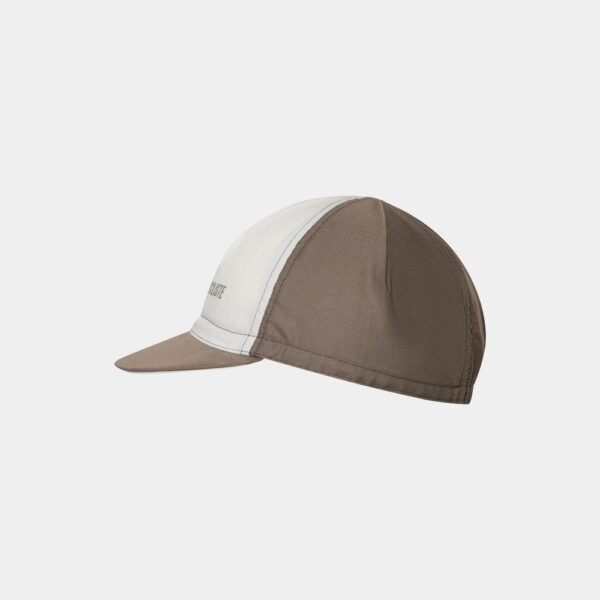 Side profile of the Cafe du Cycliste Gapette cap showing the short peak and elasticated back