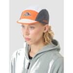 Female rider wearing the Cafe du Cycliste Gravel Summer cap, front view
