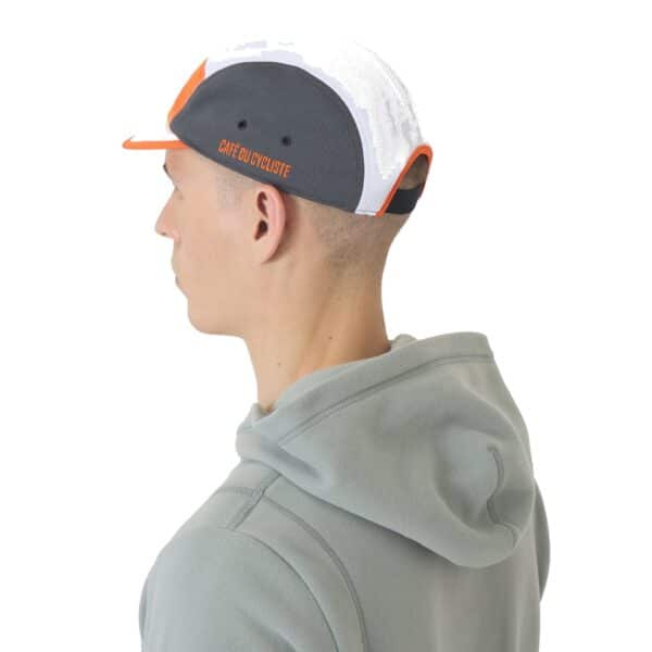 Side view of a rider wearing the Gravel Summer cap showing the five-panel mesh construction