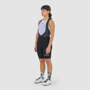 Cyclist wearing the Cafe du Cycliste Graziella bib shorts in Black, front view
