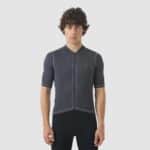 Cyclist wearing the Cafe du Cycliste Laurette jersey in Cold Dye Anthracite, front view