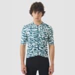 Cyclist wearing the Cafe du Cycliste Laurette jersey in Stars Dark Sea, front view