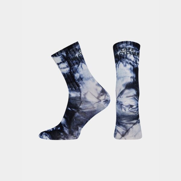 Pair of Cafe du Cycliste Tie Dye socks in Navy showing the high cuff and logo