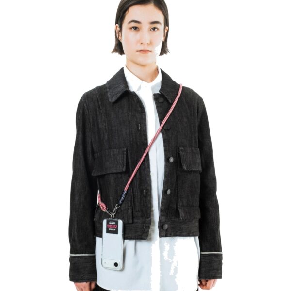 The Topologie 8mm rope strap worn crossbody carrying a phone case