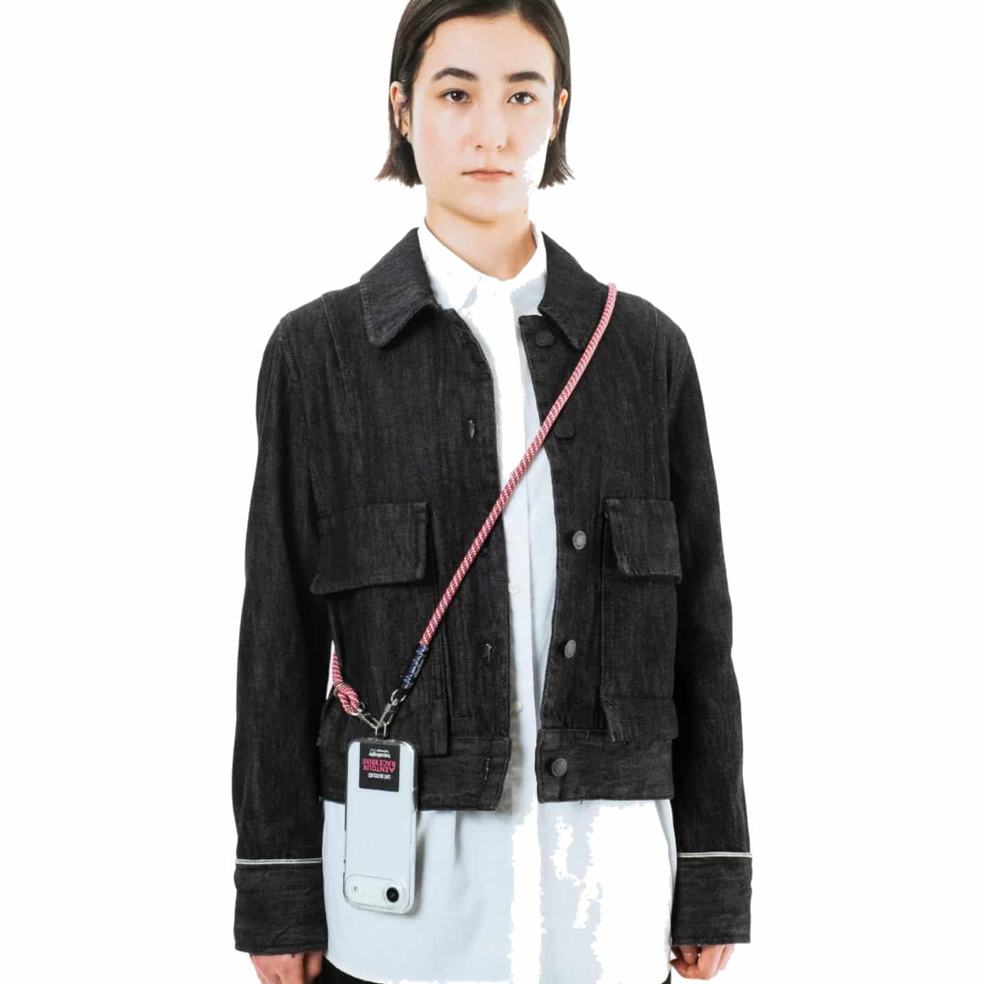 The Topologie 8mm rope strap worn crossbody carrying a phone case