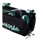 The bottle sacoche open with a water bottle in its dedicated holder and keys clipped to the internal key hook