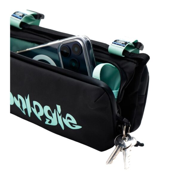 The bottle sacoche open with a water bottle in its dedicated holder and keys clipped to the internal key hook