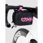 The medium bottle sacoche mounted as a handlebar bag on a road bike