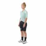 Three quarter view of a woman wearing the jadeite Cafe du Cycliste Vinciane jersey