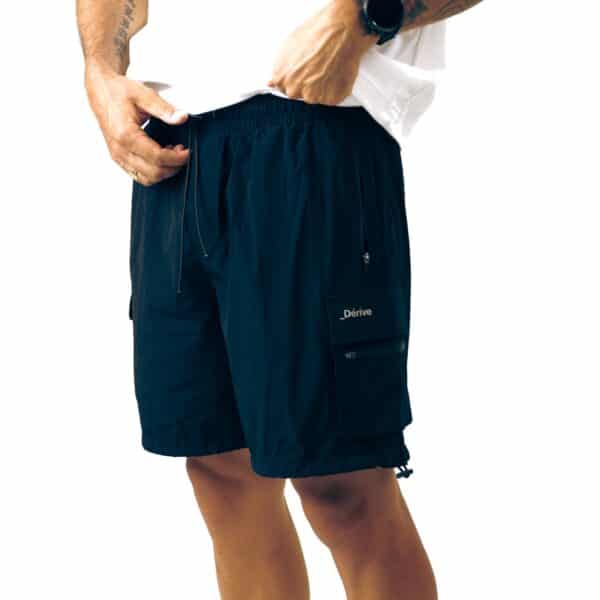 Dérive DRFT black cargo shorts, close-up of the elastic drawcord waistband and logo cargo pocket