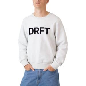 Dérive DRFT light grey cotton sweatshirt, worn front view with the black DRFT chest logo, relaxed fit and ribbed cuffs and hem