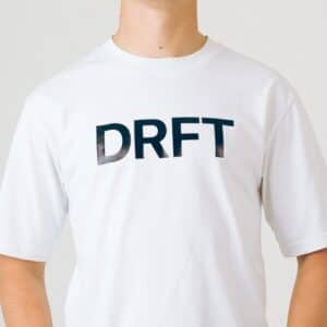 Dérive DRFT white T-shirt close-up of the DRFT chest print, crew neck and dropped shoulder