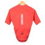 Dérive Origin men’s cycling jersey in _Dérive Red, back view with rear pockets and ORIGIN print