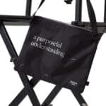 Dérive Purposeful Musette cycling bag in black with printed script and Dérive APPRL logo