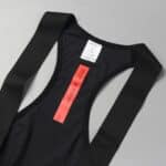 Dérive Volume bib shorts, close-up of the laser-cut straps and rear label