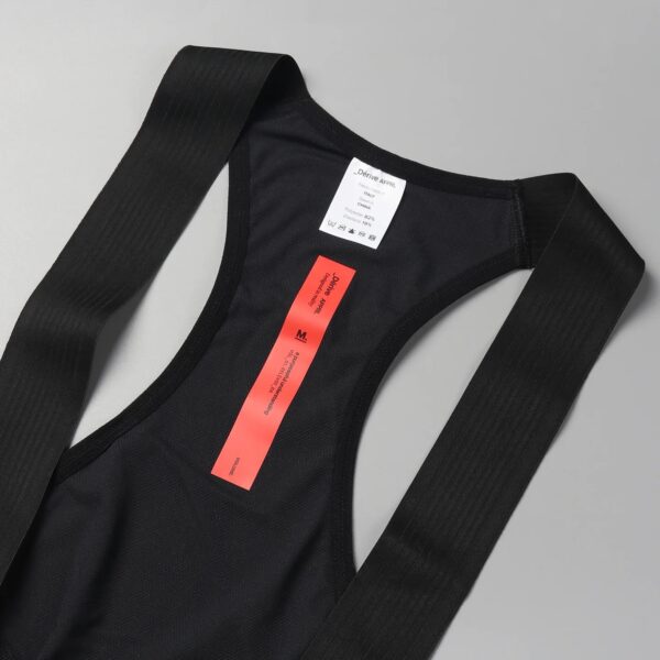 Dérive Volume bib shorts, close-up of the laser-cut straps and rear label