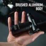 Compact Dynamic AirForce Max in the palm of a hand, brushed aluminium body