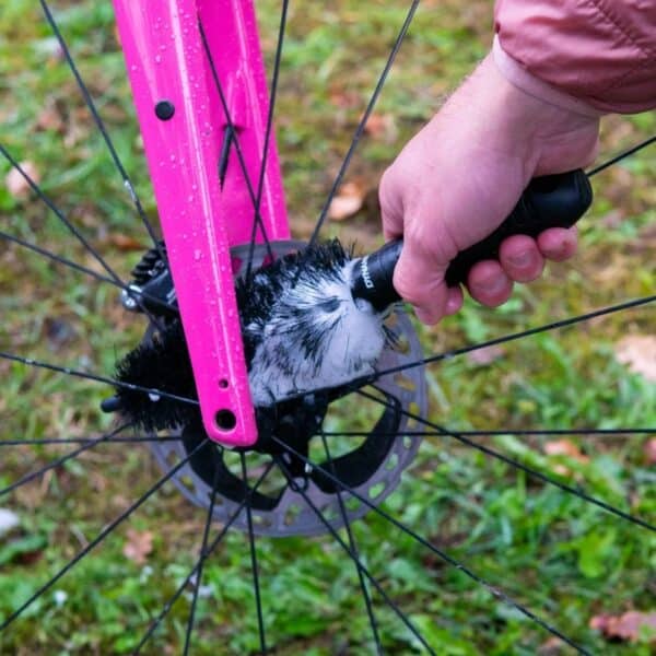 Dynamic Cone Brush cleaning the rear wheel hub and disc rotor area