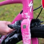 Dynamic Cone Brush scrubbing foam from the fork crown behind the front tyre