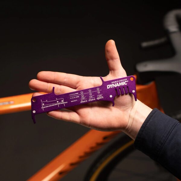 Pocket-sized Dynamic Double Checker held in the palm of a hand