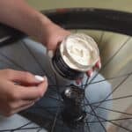 Open jar of Dynamic Galli Grease Pro showing the white bearing grease inside