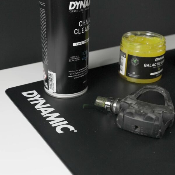 Dynamic Mat Max used as a tool mat with a pedal, grease and chain cleaner on it