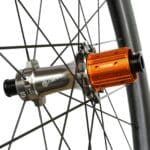 Close-up of the Farsports CH01R ratchet rear hub and orange Shimano HG freehub body