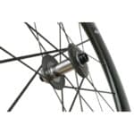Close-up of the Farsports Ultimate EVO S5 front hub showing the one-piece carbon spokes moulded into the hub flange