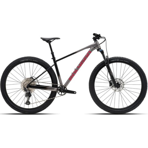 Polygon Xtrada 6 hardtail mountain bike in Charcoal Black with red Polygon logo, 29-inch wheels, side view