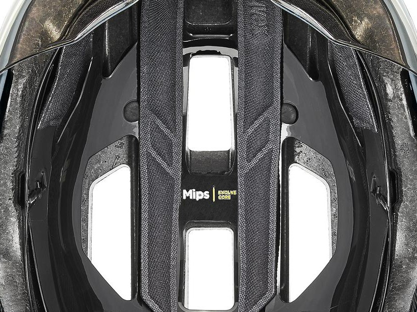 Close-up inside the uvex stride visor MIPS showing the Mips slip-plane layer and Mips label above the EPS liner