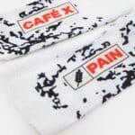 Close-up of the CAFÉ X PAIN logo and mesh on the Café du Cycliste Aero Socks