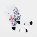 Pair of Café du Cycliste Aero Socks in the Pain print, flat lay