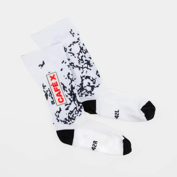 Pair of Café du Cycliste Aero Socks in the Pain print, flat lay