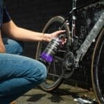 Spraying Dynamic Super Soap onto the chainstay and drivetrain area