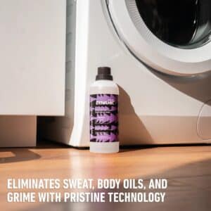 Dynamic Washcraft Pro next to a washing machine: eliminates sweat, body oils and grime with Pristine Technology