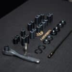 Farsports thru axle kit threaded ends, washers, ratchet wrench and T15 bits laid out
