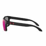 Side profile of the Oakley Holbrook OO9102-36 showing the matte black temple with the red Oakley icon and rivets