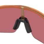 Close-up of the Unobtainium nosepad on the Oakley Sutro Lite S Matte Transparent Ginger frame