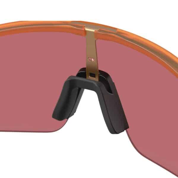 Close-up of the Unobtainium nosepad on the Oakley Sutro Lite S Matte Transparent Ginger frame