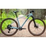 Polygon Heist 5 in Blue on a gravel path, drive side