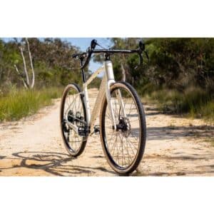 Polygon Tambora G4 in White, front three-quarter view on a gravel track (model photo)