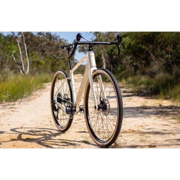 Polygon Tambora G4 in White, front three-quarter view on a gravel track (model photo)
