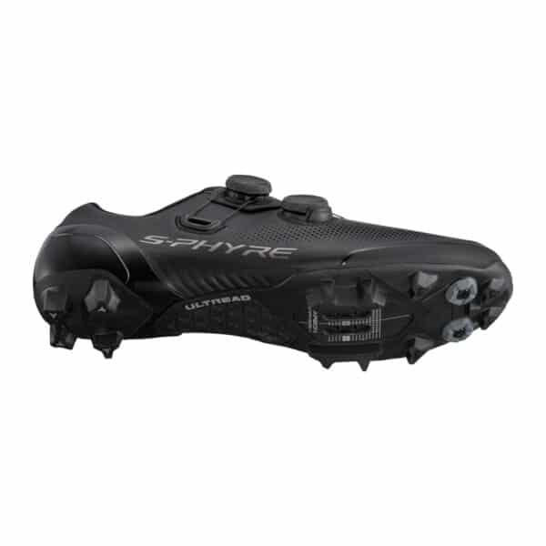 Shimano SH-XC903 sole profile showing the ULTREAD XC tread and toe spike mounts