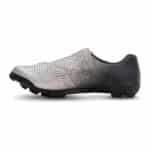 Inner side of the Shimano SH-RX801 gravel shoe, perforated silver upper and black heel