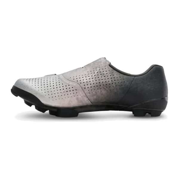 Inner side of the Shimano SH-RX801 gravel shoe, perforated silver upper and black heel